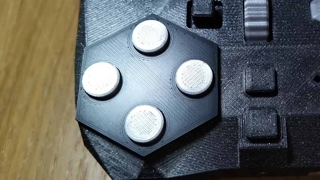 Zoomed in picture of conductive P.L.A. portion around the right hand size face buttons.